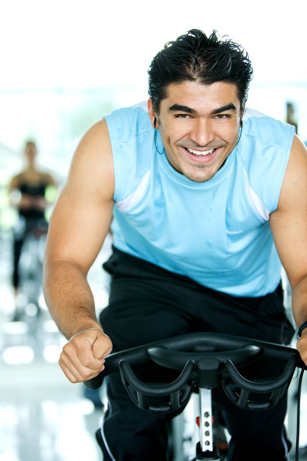 man spinning at the gym