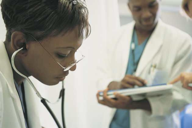 Physician using stethoscope