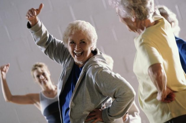 Group of senior women exercising in a health club