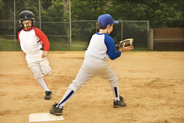 Young boys playing in baseball game
