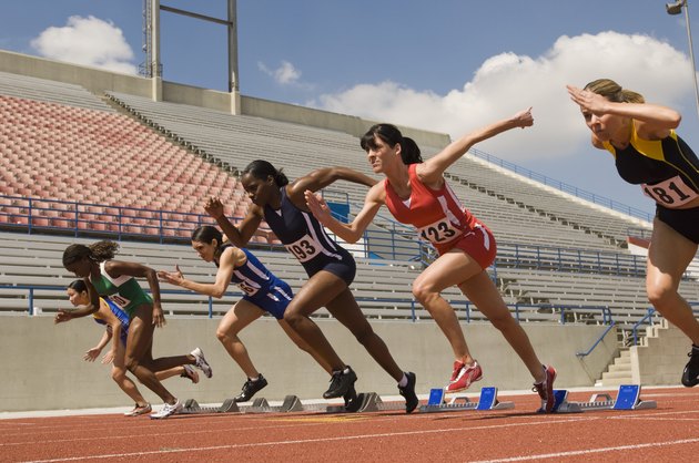 Group of female track athletes sprinting