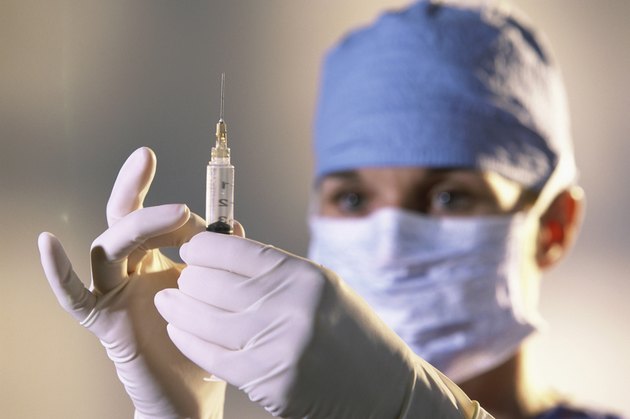 Female doctor holding a syringe