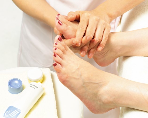 Aesthetician Who Rubs Cream on Womans Leg, Side View