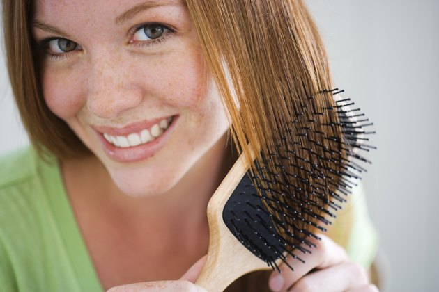 Woman combing her hair