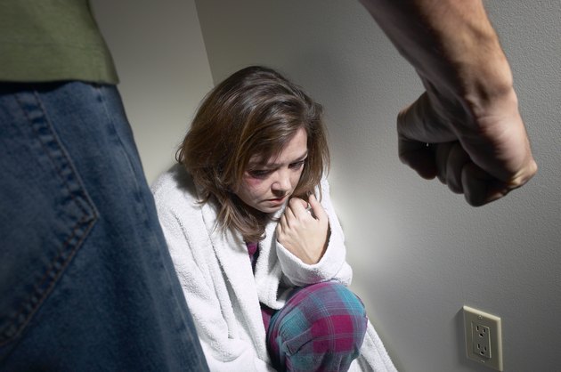 Abused woman in a corner