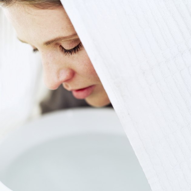 close-up of a woman inhaling vapours