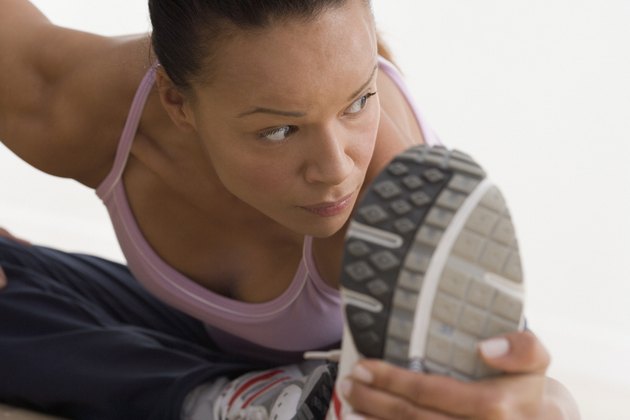 Close up of woman stretching