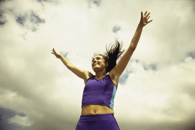 Low angle view of a young woman exercising