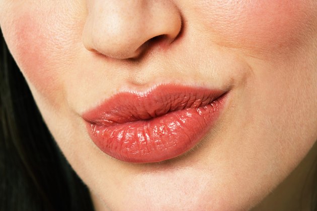 Young woman puckering lips, close-up