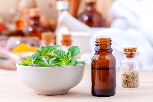Natural Spa Ingredients essential oil with oregano leaves for ar