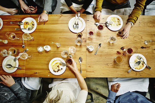 Overhead view of friends at table during party