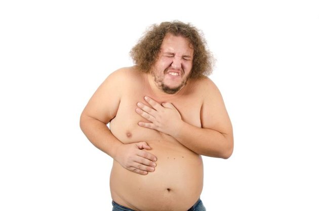 Stress and unhealthy lifestyle. Heart attack at the fat guy.