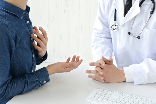 Patient's hand while explaining for doctor