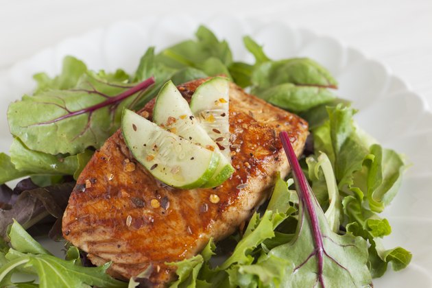 Grilled salmon over bed of spring mix salad