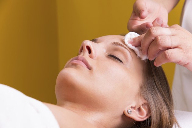 Beautician face cleaning.
