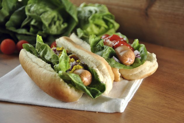 two hot dogs with salad