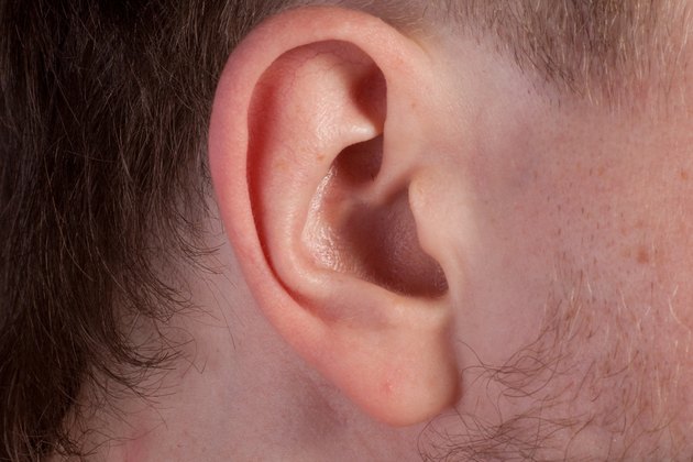 Men's ear. Close up.