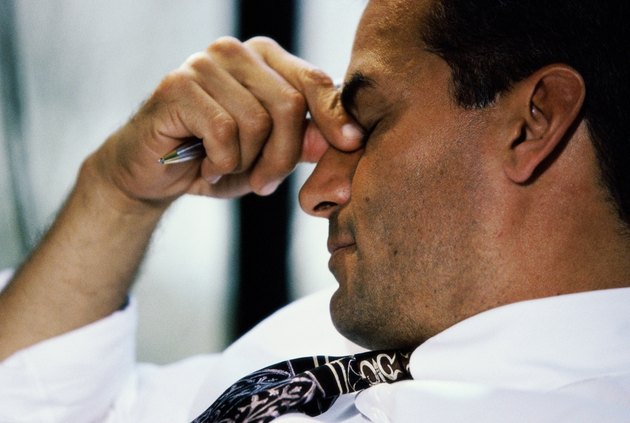 portrait of business man with his eyes shut