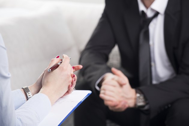 psychiatrist examining a male patient