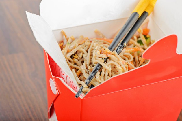 Meat and noodles in red take away container