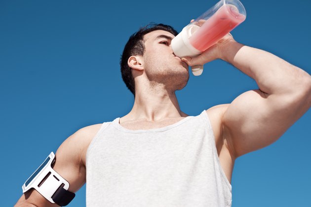 Athlete drinking protein cocktail