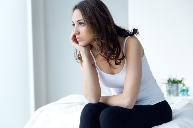 Young woman suffering from insomnia in the bed.