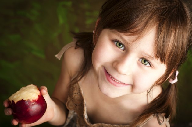 Little girl with apple