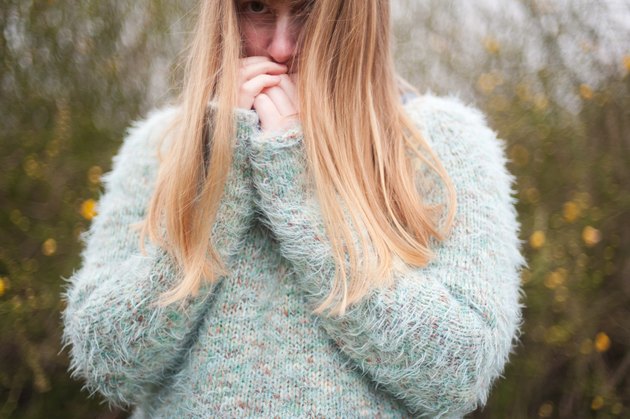 Blonde woman wearing fluffy jumper