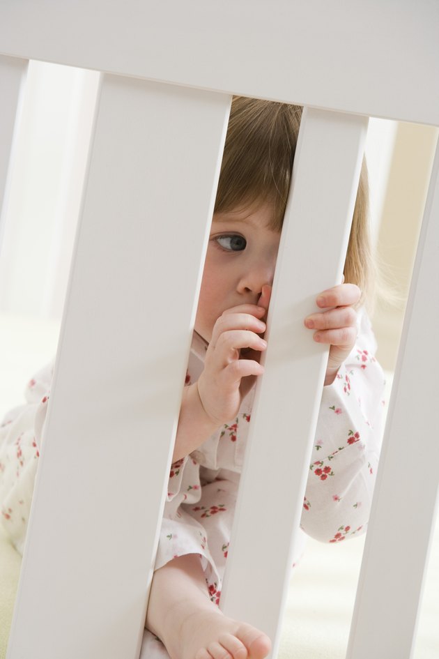 Toddler in crib