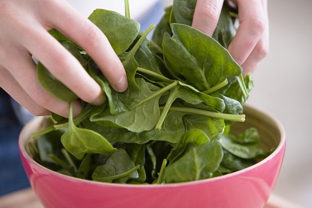 Person preparing spinach