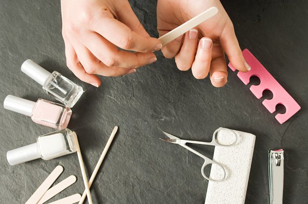 Woman manicuring hands