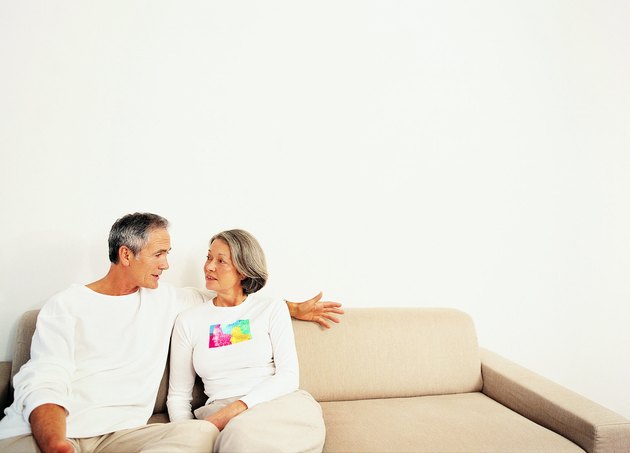 Mature Couple Talking on a Sofa