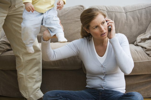 Mid adult woman using a mobile phone