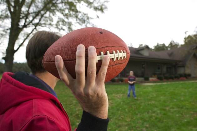 Father and son playing football