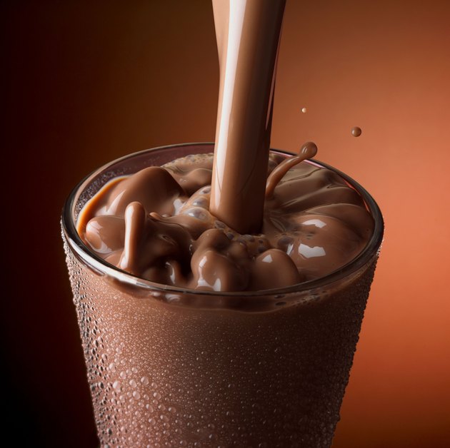 Chocolate milk pouring into glass
