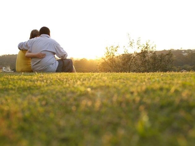 Hugged couple at the sunshine