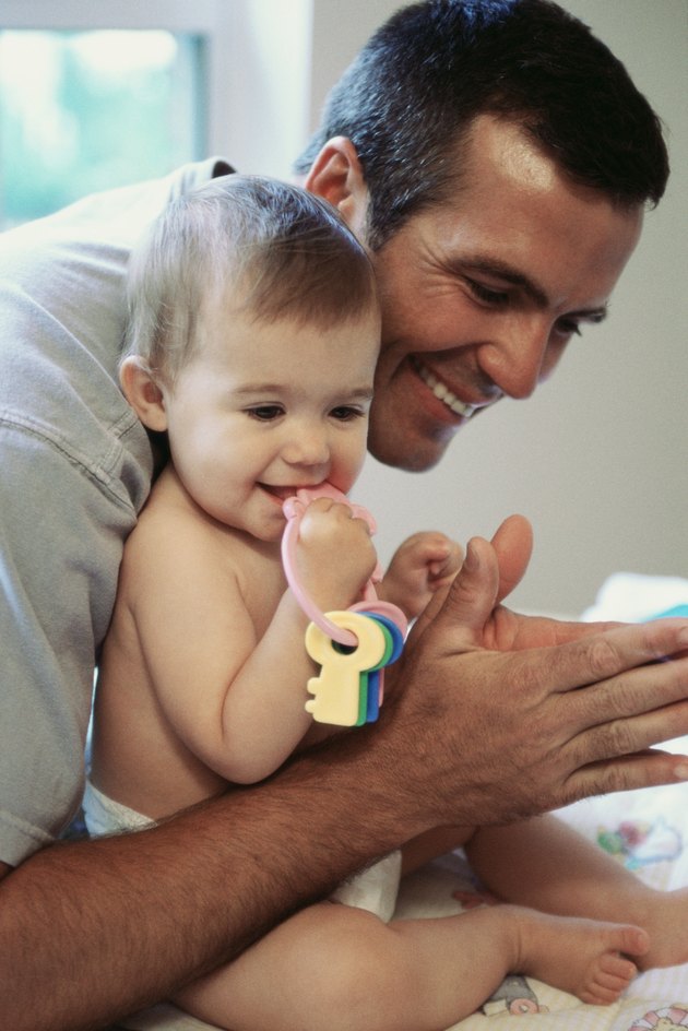 Side profile of a father playing with his daughter