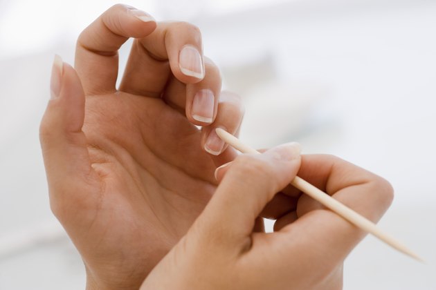 Pushing cuticle of fingernail