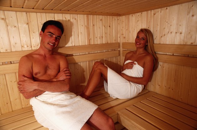 Couple sitting in sauna