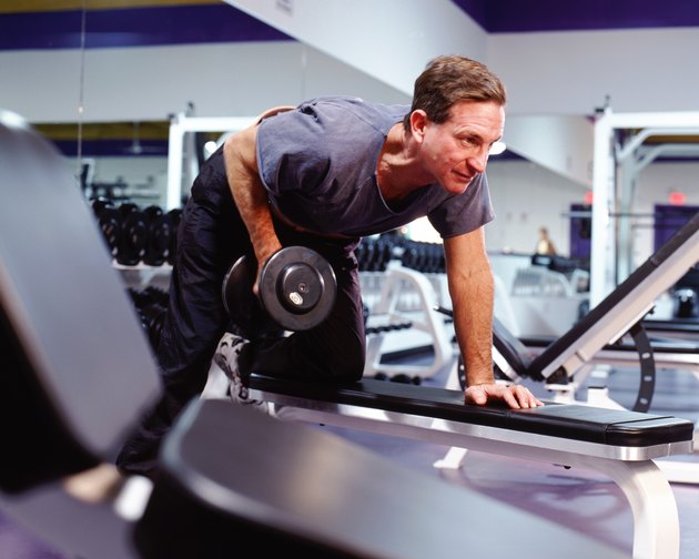 Man lifting weights in gym