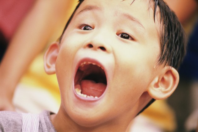 Close-up of a boy with his mouth open
