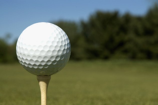 Golf ball on tee on golf course
