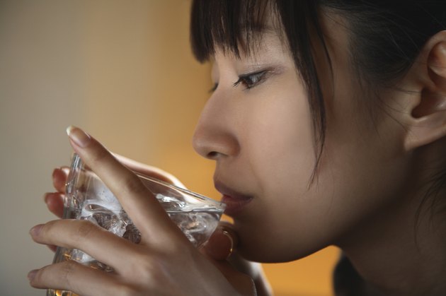Close-up of Young Woman Drinking Water