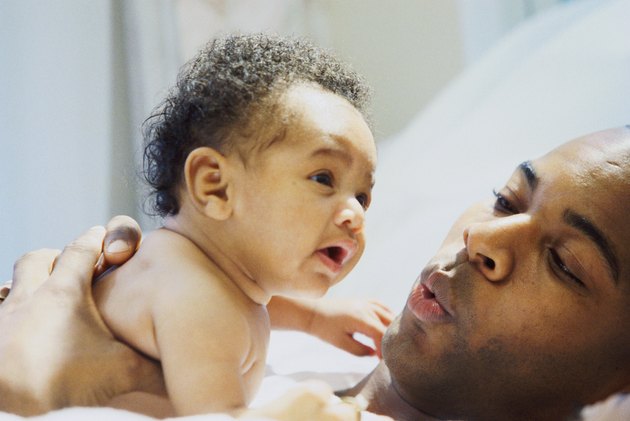 Close-up of a father consoling his daughter