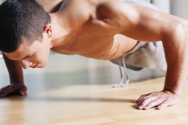 Man exercising in gym - push ups