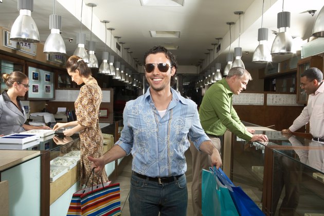 Young man shopping in department store