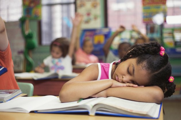 Girl sleeping in class