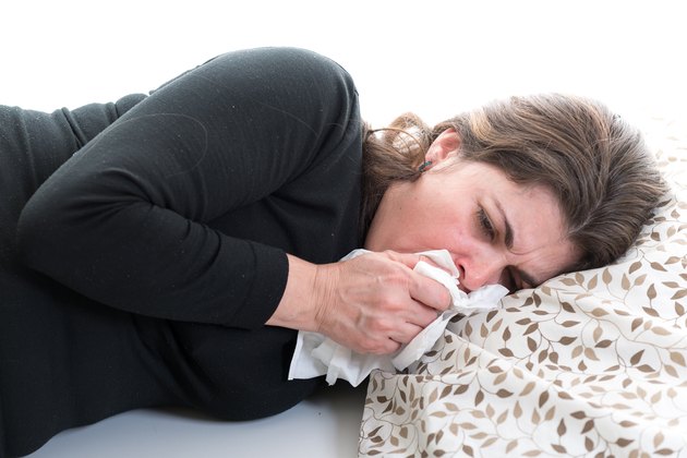 Middle age woman suffering from cold