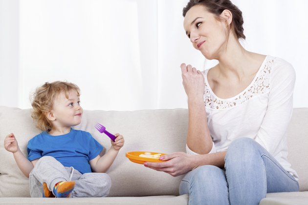 Mum and child eating meal together