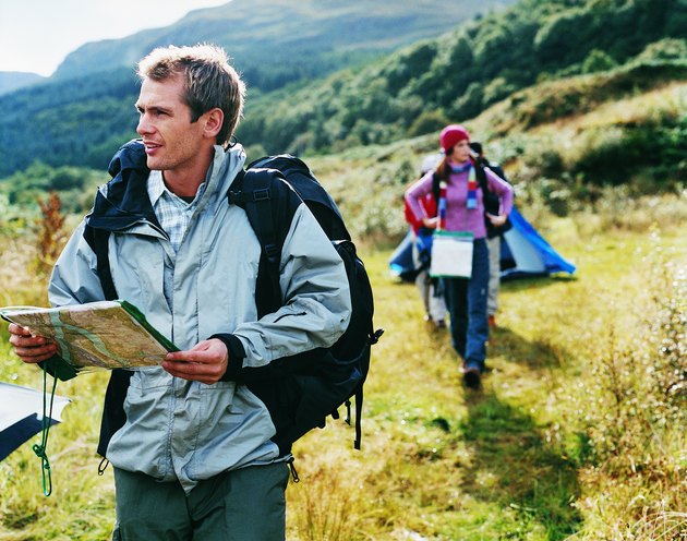Two Young Adults Leave Their Tent to go Orienteering